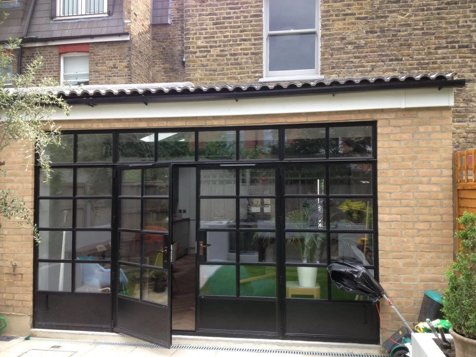Completed rear home extension with black-framed glazing